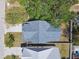 An overhead view reveals a home's distinct roof design, highlighting its architectural details and neighborhood setting at 3106 W Cherokee Ave, Tampa, FL 33611