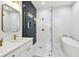 Modern bathroom featuring a glass-enclosed shower, soaking tub, and stylish fixtures at 3106 W Cherokee Ave, Tampa, FL 33611