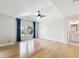 Spacious main bedroom with tray ceiling, hardwood floors, two windows and an ensuite bathroom at 3106 W Cherokee Ave, Tampa, FL 33611