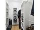 Walk-in closet offering shelving and storage for shoes, clothes, and accessories at 3106 W Cherokee Ave, Tampa, FL 33611