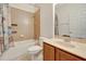 Bathroom featuring tiled shower/tub combo, toilet, and vanity with marble countertop at 3510 Hickory Hammock Loop, Wesley Chapel, FL 33544