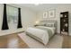Bedroom with natural light and decor and hardwood floors at 3510 Hickory Hammock Loop, Wesley Chapel, FL 33544