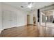 Generous bedroom with wood floors, ceiling fan, and access to a screened patio, blending indoor/outdoor living at 3510 Hickory Hammock Loop, Wesley Chapel, FL 33544