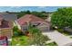 Well-maintained home featuring mature landscaping, a brick facade, and an attached two-car garage at 3510 Hickory Hammock Loop, Wesley Chapel, FL 33544