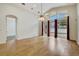 Spacious living room with wood-look tile floors and sliding doors to the backyard at 3510 Hickory Hammock Loop, Wesley Chapel, FL 33544
