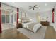 Relaxing main bedroom with a ceiling fan, wood floors, and sliding glass doors to the patio at 3510 Hickory Hammock Loop, Wesley Chapel, FL 33544