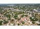 An aerial view of a neighborhood shows rows of houses and green trees at 511 Glenoak N St, St Petersburg, FL 33703