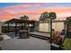Inviting backyard with a spacious patio, charming pergola, lush landscaping, and an outdoor dining area at 511 Glenoak N St, St Petersburg, FL 33703
