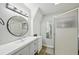 Modern bathroom featuring a spacious vanity with ample storage and a sleek glass-enclosed shower at 511 Glenoak N St, St Petersburg, FL 33703