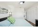 Comfortable bedroom showcases a light blue queen bed and closet with bi-fold doors at 511 Glenoak N St, St Petersburg, FL 33703