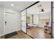 Bright bedroom with a sliding mirror door, closet, and modern ceiling fan at 511 Glenoak N St, St Petersburg, FL 33703