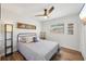 Comfortable bedroom featuring a stylish ceiling fan, wood-look flooring, and a neutral color palette at 511 Glenoak N St, St Petersburg, FL 33703