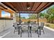 Charming covered patio with dining set and outdoor servery area, ideal for entertaining guests at 511 Glenoak N St, St Petersburg, FL 33703