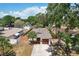 Attractive single-story home with a manicured lawn, palm trees, and screened in entryway at 511 Glenoak N St, St Petersburg, FL 33703