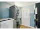 Efficient laundry area with modern stacked washer and dryer set, offering convenience and space-saving design at 511 Glenoak N St, St Petersburg, FL 33703