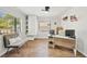 Inviting home office featuring a built-in cabinet, modern desk, and comfortable seating at 511 Glenoak N St, St Petersburg, FL 33703