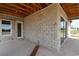 The house under construction has an exterior patio with white trim door and windows at 5269 Everlong Dr, Apollo Beach, FL 33572