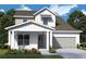 Charming two-story home with a well-manicured lawn and attached garage at 5269 Everlong Dr, Apollo Beach, FL 33572