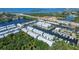 Aerial view of a waterfront townhome community with boat docks and easy access to the water at 5912 Anchorage S Way, St Petersburg, FL 33712