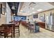 Clubhouse featuring a bar area with seating, stainless steel appliances, and mounted TVs at 5912 Anchorage S Way, St Petersburg, FL 33712