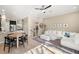 Bright, open living room with staircase features tile flooring and a comfortable white sofa at 5912 Anchorage S Way, St Petersburg, FL 33712