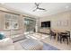 Bright and airy living room with a sliding glass door to the balcony and modern furnishings at 5912 Anchorage S Way, St Petersburg, FL 33712