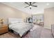 Spacious main bedroom featuring a ceiling fan, neutral colors, and bright natural light at 5912 Anchorage S Way, St Petersburg, FL 33712