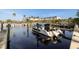 Picturesque marina with boats docked on the water and building in background with palm trees at 5912 Anchorage S Way, St Petersburg, FL 33712