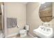 Well-maintained powder room featuring a white toilet and pedestal sink, with neutral walls and tile floors at 5912 Anchorage S Way, St Petersburg, FL 33712