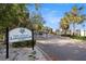 The Cove at Loggerhead Marina entrance sign with lush landscaping and trees at 5912 Anchorage S Way, St Petersburg, FL 33712