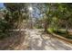 Picturesque walking path surrounded by lush trees and foliage, providing a serene outdoor experience at 5912 Anchorage S Way, St Petersburg, FL 33712