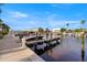 Waterfront view featuring a community dock, boats, and a walkway by the waterfront at 5912 Anchorage S Way, St Petersburg, FL 33712