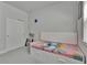 Clean bedroom with a daybed, closet, and bright natural light at 5922 Grand Sonata Ave, Lutz, FL 33558