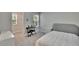 Comfortable bedroom with carpeted floors, a window, and space for a keyboard at 5922 Grand Sonata Ave, Lutz, FL 33558