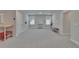 Spacious bonus room with two windows, overhead lighting, and neutral walls and flooring at 5922 Grand Sonata Ave, Lutz, FL 33558