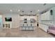 Modern kitchen featuring a large island with bar seating, stainless steel appliances, and ample cabinet space at 5922 Grand Sonata Ave, Lutz, FL 33558