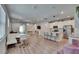 Bright and airy open concept living space with modern decor and an integrated kitchen at 5922 Grand Sonata Ave, Lutz, FL 33558