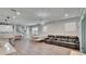 Spacious living room with open-concept design, blending kitchen, dining, and seating areas at 5922 Grand Sonata Ave, Lutz, FL 33558