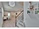 Open-concept living space with modern finishes, including laminate flooring and stylish light fixtures at 5922 Grand Sonata Ave, Lutz, FL 33558