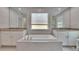 Beautiful main bathroom featuring a soaking tub and dual vanities at 5922 Grand Sonata Ave, Lutz, FL 33558