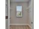 Walk-in closet with natural light and shelf storage at 5922 Grand Sonata Ave, Lutz, FL 33558