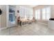 Versatile flex room with storage cabinets, a door to the screened porch, and large windows with white shutters at 6015 Shell Ridge Dr, Lithia, FL 33547