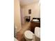 Bathroom features a single sink vanity with black countertop, tile floors, and a toilet at 631 Haven Pl, Tarpon Springs, FL 34689