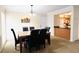 Cozy dining room features a marble-topped table with seating for six, adjacent to the kitchen for easy serving at 631 Haven Pl, Tarpon Springs, FL 34689