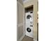 Laundry room with stacked washer and dryer at 631 Haven Pl, Tarpon Springs, FL 34689