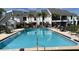 Inviting community pool with ample seating and lush landscaping at 631 Haven Pl, Tarpon Springs, FL 34689