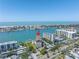 Aerial view of waterfront condo community with stunning bay views and lush landscaping at 650 Island Way # 204, Clearwater Beach, FL 33767