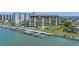 Waterfront condominium complex featuring boat slips and a beautiful outdoor pool at 650 Island Way # 204, Clearwater Beach, FL 33767