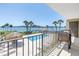 Enjoy waterfront views from this balcony overlooking the pool area at 650 Island Way # 204, Clearwater Beach, FL 33767