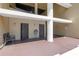 Well-maintained condo common area with seating, water fountain, and bathroom entrances at 650 Island Way # 204, Clearwater Beach, FL 33767